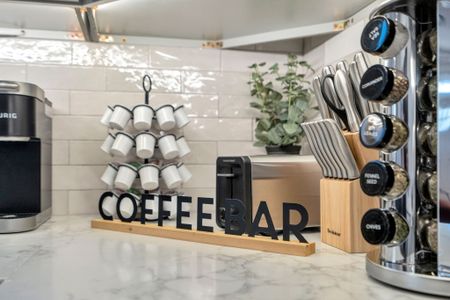 Brew your morning cup at the coffee bar w/ a mug tree & toaster ready to go