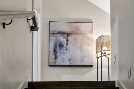 Abstract art and a woven lamp for calm vibes