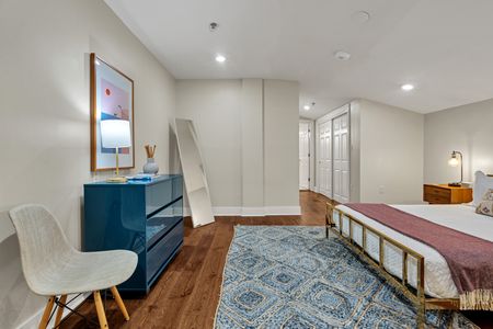 Teal dresser and patterned rug for extra charm