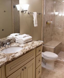 Bathroom w/ granite vanity & fresh linens