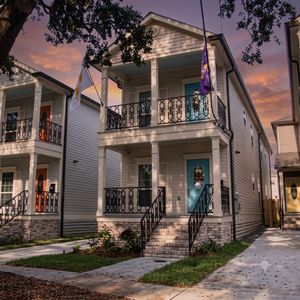 Charming New Construction exterior w/ classic balcony details.