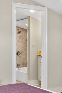 Stone-tiled shower with rainfall-style comfort