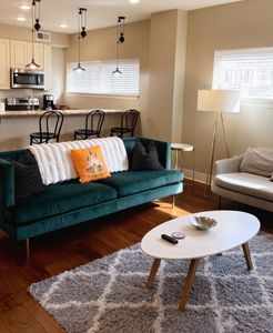 Bright living room w/ velvet seating & dining area