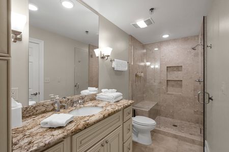 Glass shower and towels stacked and ready