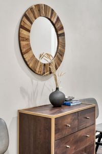 Sunburst wood mirror with an artful touch