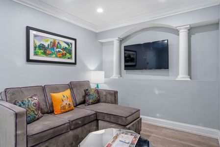 Cozy lounge corner w/ bold accents — made for movie nights in.