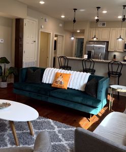 Cozy lounge w/ plush sofa & natural light