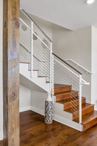Sleek modern staircase with white railings