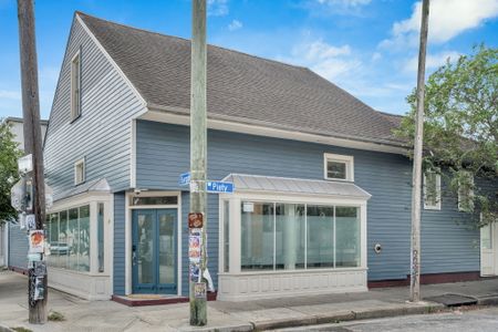 Corner home with picture windows and curb appeal