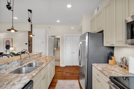 Kitchen flowing to the hallway and closets