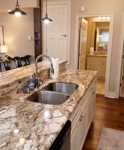 Kitchen w/ granite island, double sink & ample cabinet space