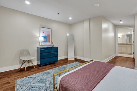Spacious bedroom with a vibrant teal accent