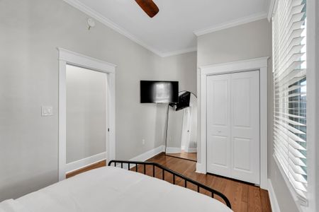 Catch a show in bed w/ the wall-mounted TV, plus a roomy closet for your things