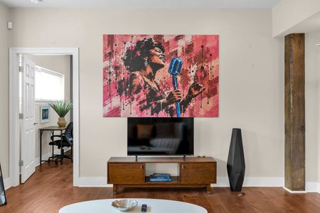 Smart TV under bold New Orleans artwork
