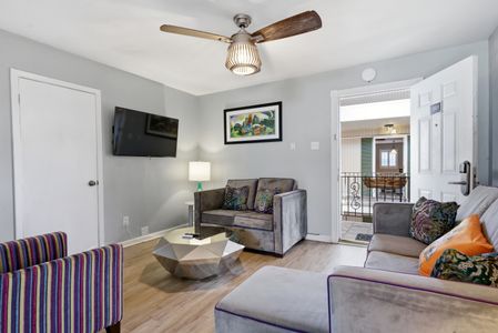 Sun-filled living area w/ a warm, inviting feel to relax & recharge.