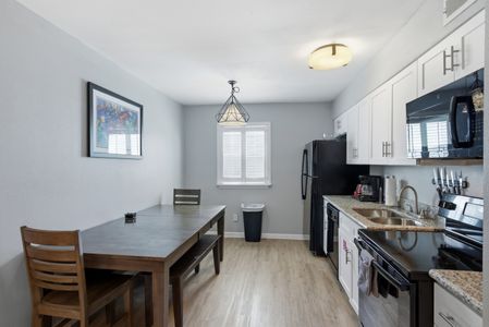 Sleek kitchen & dining area w/ everything you need to cook & gather.