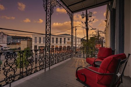Take in the views from your private balcony w/ cozy red chairs
