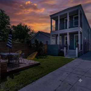 Spacious backyard w/ covered porch & plenty of seating to gather & unwind.