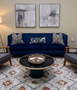 Tastefully decorated lounge with a statement blue sofa