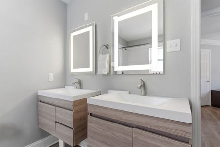 Clean, bright bathroom w/ dual sinks & all the essentials to freshen up.