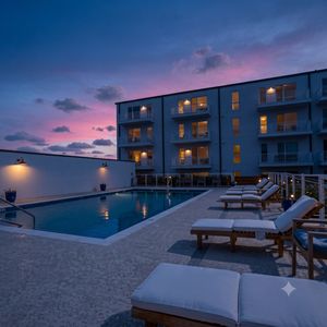 Resort-style pool w/ lounge chairs — perfect for a lazy afternoon soak.