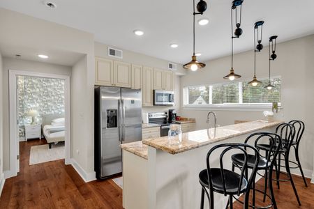 Sunlit kitchen with views out the window