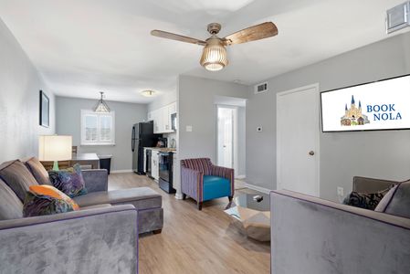 Spacious open-plan living & dining area filled w/ natural light.