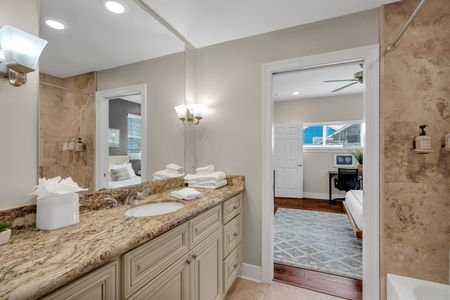 Double vanity with a peek into the bedroom