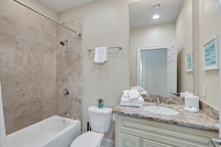 Fresh towels and a glass shower waiting for you