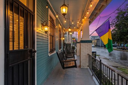 Cozy front porch entry w/ character-filled details & a warm, welcoming feel.