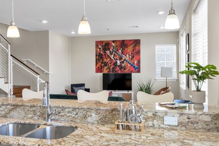 Living room view framed by bold red artwork