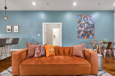 Velvet sofa against a calming blue wall