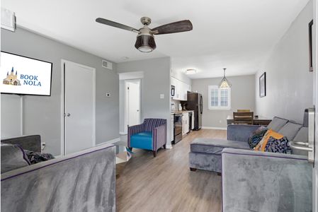 Open-concept living area w/ Smart TV & stylish furnishings for relaxed evenings in.