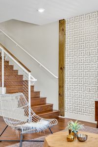 Rich hardwood staircase with modern railing