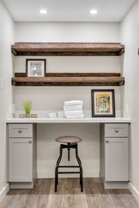 Work desk with a floating reclaimed shelf
