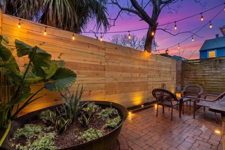 Sunny, fenced backyard patio — your own tucked-away outdoor retreat.