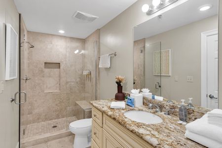 Modern bath with walk-in shower and granite