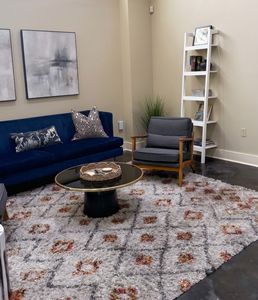 Bright living space with layered textures and comfortable furnishings