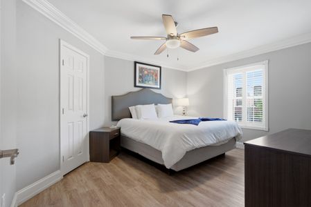 Cozy bedroom w/ a bed, warm tones & a Smart TV for winding down.