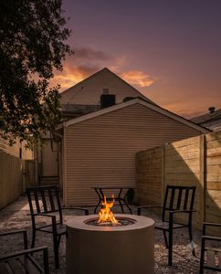 Private courtyard w/ a firepit & seating — ideal for unwinding after a long day.