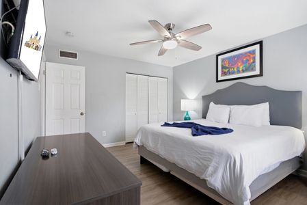 Unit 307 – Serene primary bedroom w/ a plush bed for deep, restful sleep.