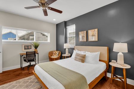 Cozy charcoal bedroom with a little desk nook