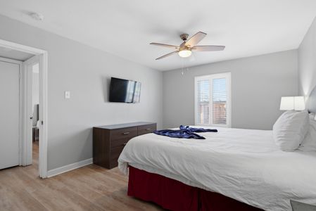 Secondary queen bedroom w/ a smart TV — comfortable & ready for guests.