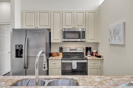 Stocked kitchen with stainless steel appliances