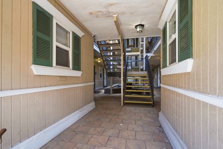 Bright stairwell w/ natural light leading up to your suite.
