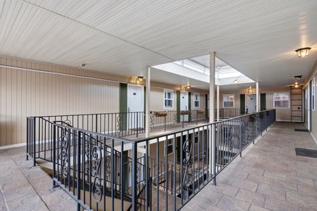 Airy gallery walkway leading up to your private suite.