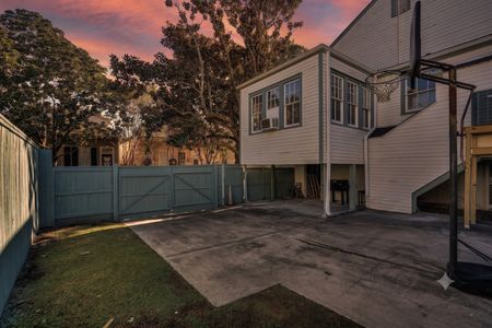 Exterior view of the property — a classic structure w/ gated access & ample space.