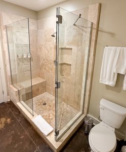 Glass-enclosed walk-in shower