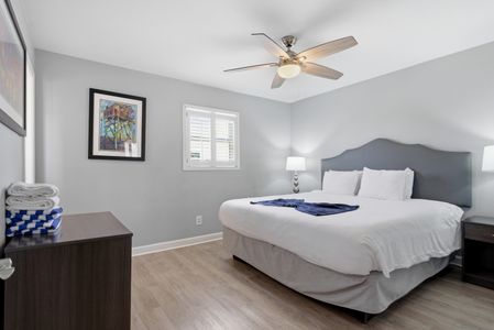 Unit 304 – Calm, light-filled bedroom w/ a king bed for a great night's rest.