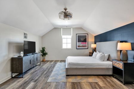 Vaulted ceiling bedroom with a Smart TV